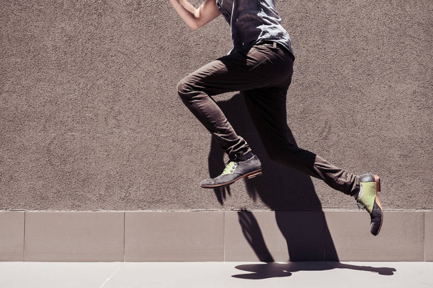 Young man walk and jump - 写真・画像