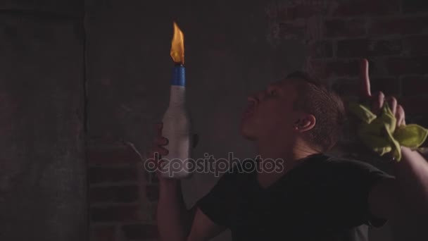 Young bartender blowing fire from his mouth at barmen show, slow motion - Záběry, video