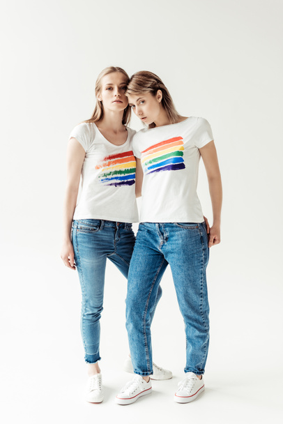 Women in white shirts with printed rainbow  - Photo, Image