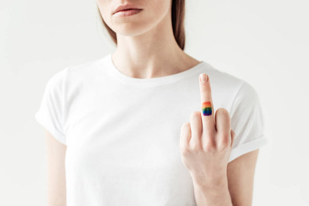 middle finger with painted rainbow flag - Фото, изображение