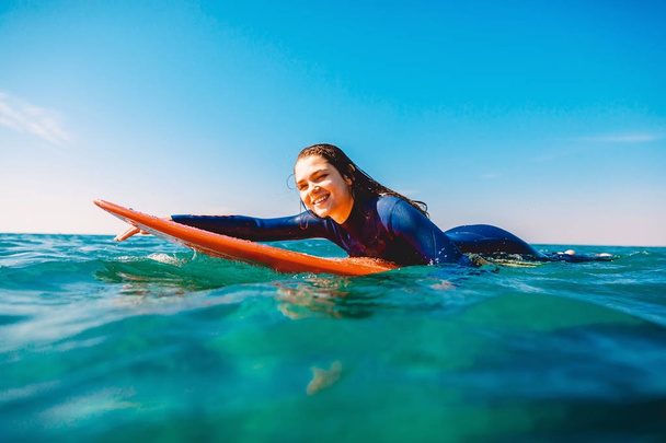 Young sexy woman  on surf board  - Foto, Imagem