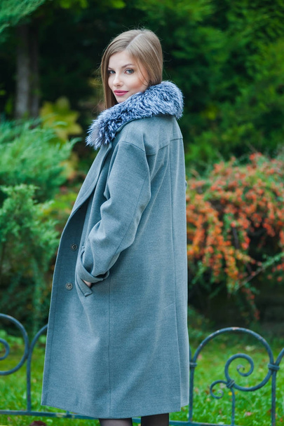 Beautiful young blonde woman wearing fur autumn coat - Фото, зображення