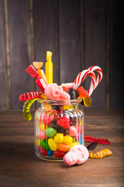 One jar with colorful candies for halloween party - Foto, imagen