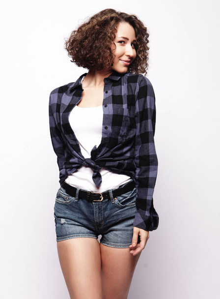 Young casual woman style over white background. - Photo, Image