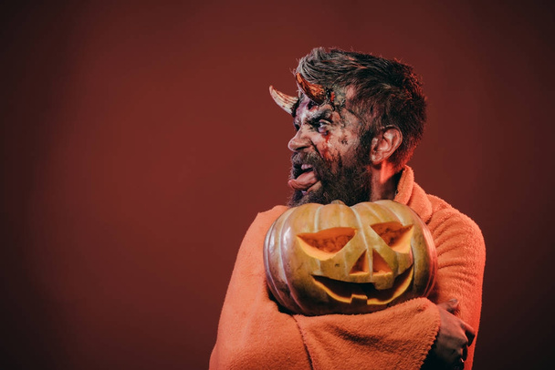 Halloween satan show tongue with horns, beard, blood, wounds - Фото, зображення