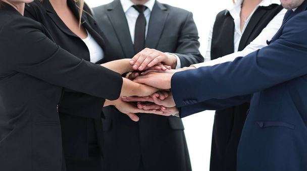 friendly business team with hands clasped together. - Фото, изображение