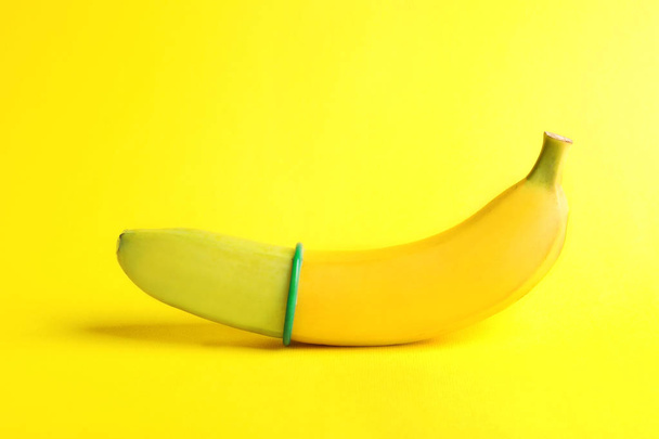 yellow banana with condom  - Fotografie, Obrázek