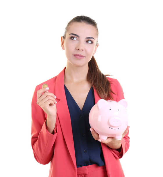 Beautiful young woman with piggy bank on white background - Fotoğraf, Görsel