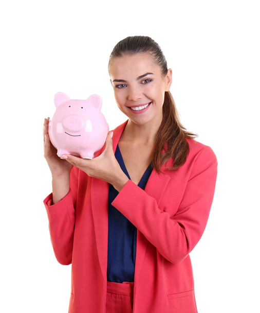 Beautiful young woman with piggy bank on white background - Fotoğraf, Görsel