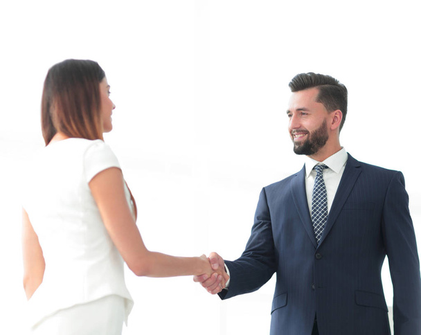 An attractive business man and woman team shaking hands - Photo, Image
