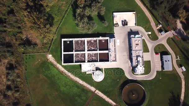 Aerial top down view flying over wastewater treatment plant also known as sewage treatment plant or sewage treatment works plant for sewage treatment process removing contaminants from wastewater 4k - Footage, Video