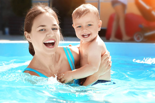 Cute little boy with mother in swimming pool - Photo, Image