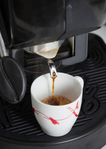 Espresso machine making coffee with pod - Фото, изображение