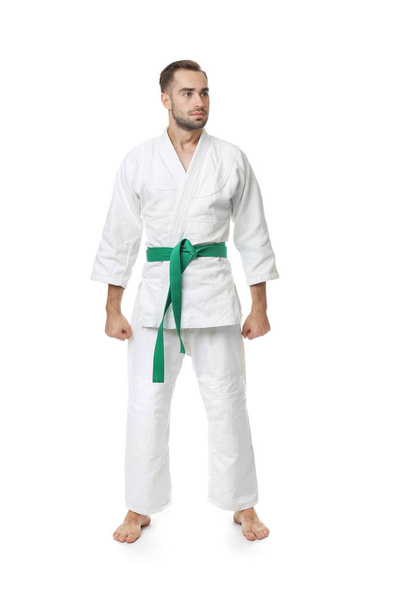 Young man in karategi on white background - Fotoğraf, Görsel