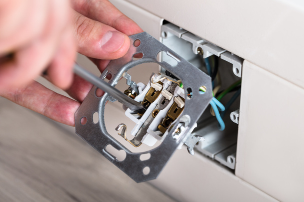 Person Repairing Electrical Socket - Foto, Imagen