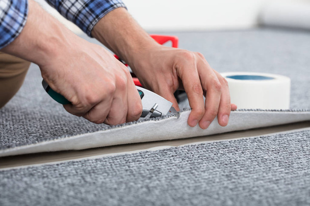 Carpenter Laying Carpet  - Fotografie, Obrázek