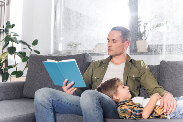 father reading book for son - Photo, Image