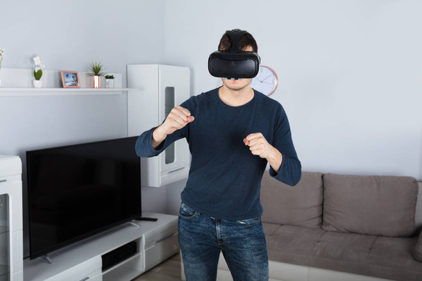 Young Man Using Virtual Reality  - Fotó, kép