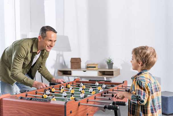 father and son playing table football - Photo, image