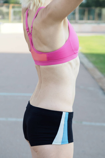 Close up of fit woman's torso - 写真・画像
