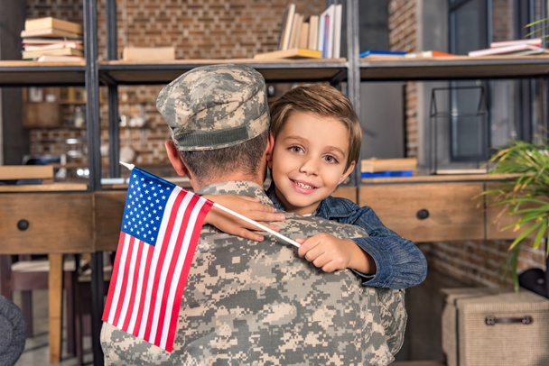 military father and son embracing - 写真・画像