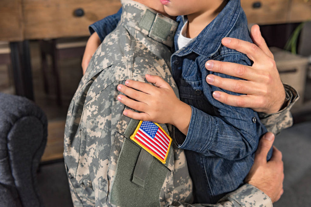 embracing military father and son - 写真・画像