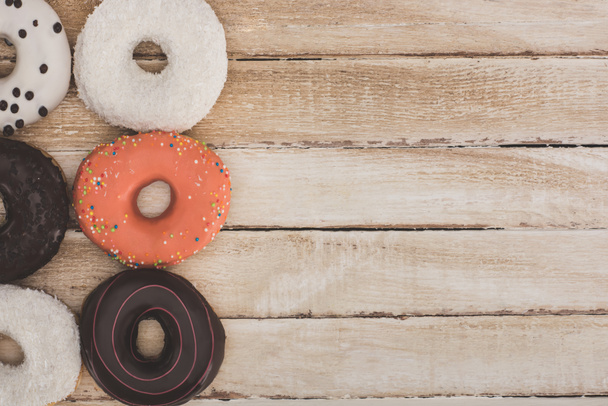 donuts on wooden table top - Photo, Image
