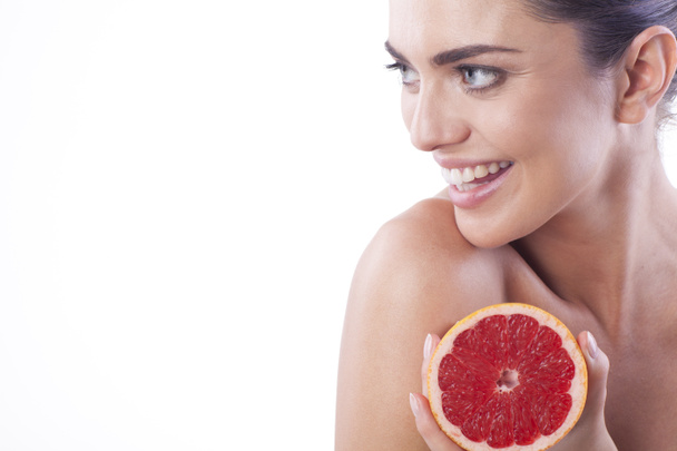Beautiful woman with grapefruit. - Photo, Image