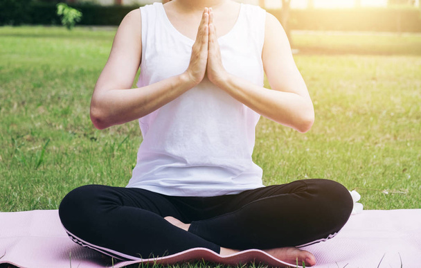 Young attractive asian girl practice yoga and relax in the park, - Fotoğraf, Görsel