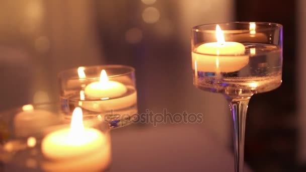 beautiful candles burning in the hall - Materiał filmowy, wideo