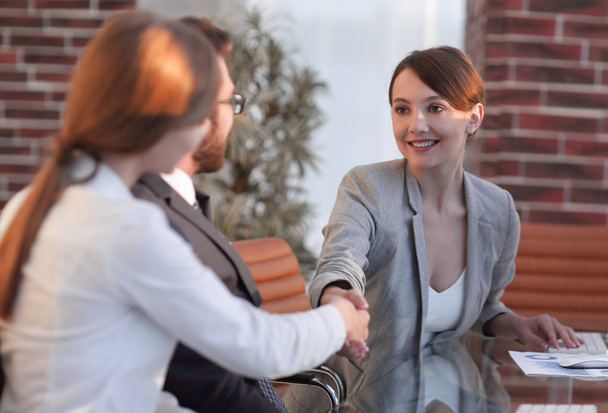 business woman greets the employee with a handshake, - Zdjęcie, obraz
