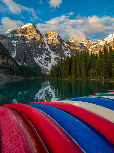Colorful canoes at Moraine Lake, Banff National Park at sunrise - Photo, Image
