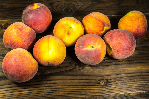 Ripe peaches on wooden table - Photo, Image