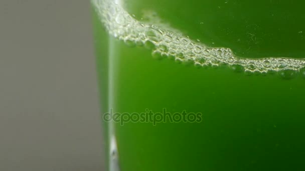 Foam & Blister on the surface of the water.A cup of green wort,wheat-juice,blis - Footage, Video