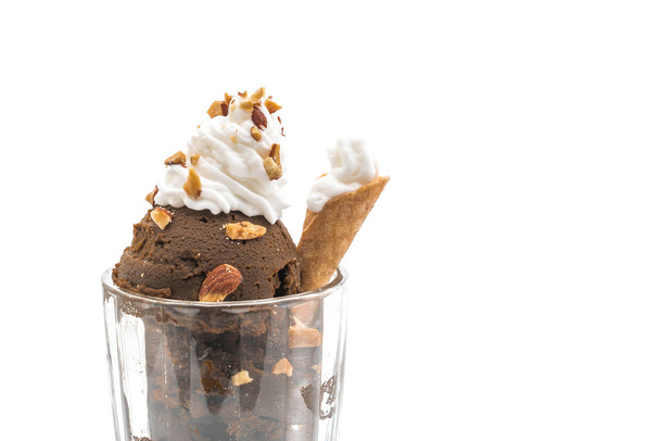 Scoop of chocolated ice cream in glass - Foto, afbeelding