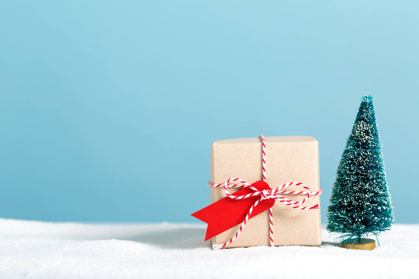 Gift box with miniature Christmas tree - Фото, изображение