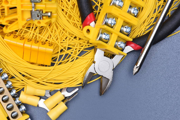 Cables, electrical equipment and tools on metal table, directly above - Photo, Image