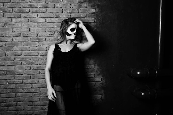 Halloween skull make up girl wear in black against brick wall at - Φωτογραφία, εικόνα