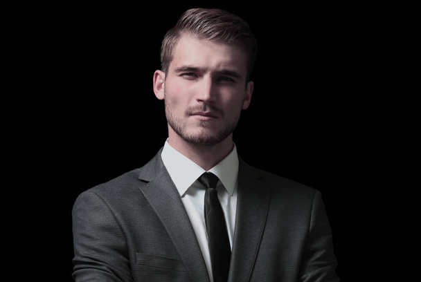 Handsome business man isolated on black with arms crossed - Foto, immagini