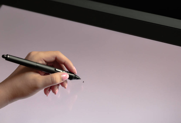 Woman hand drawing on professional graphic tablet. Black backgro - Valokuva, kuva