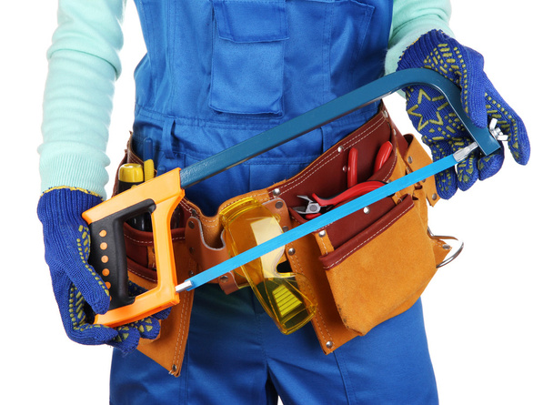 Male builder in blue overalls with saw isolated on white - Foto, Imagem