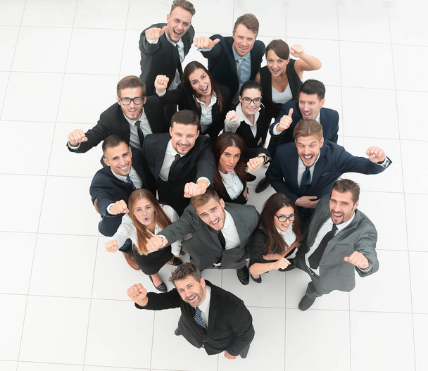 concept of success. business team raising hands and looking at camera. - Photo, Image