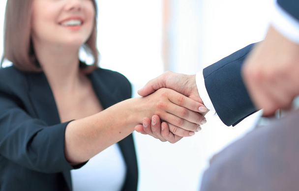 Businesswoman shaking hands to seal a deal with her partner - Φωτογραφία, εικόνα