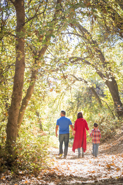 Mixed Race Caucasian and Hispanic Family Taking a Walk At The Pa - Photo, Image