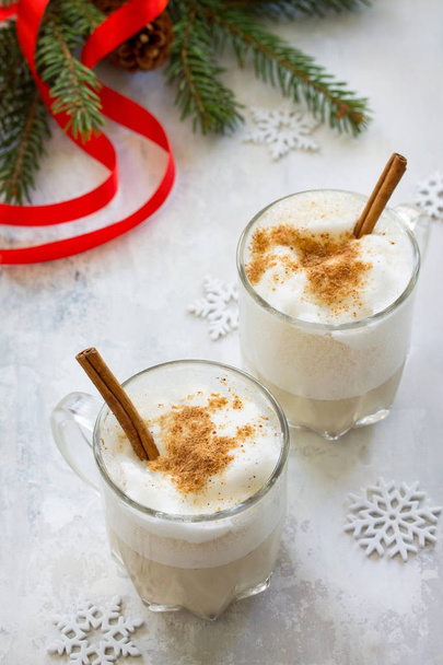 Homemade Eggnog Christmas milkshake with cinnamon, served in two - Photo, Image