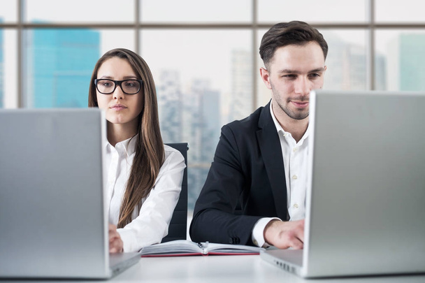Business couple working in office - Photo, image