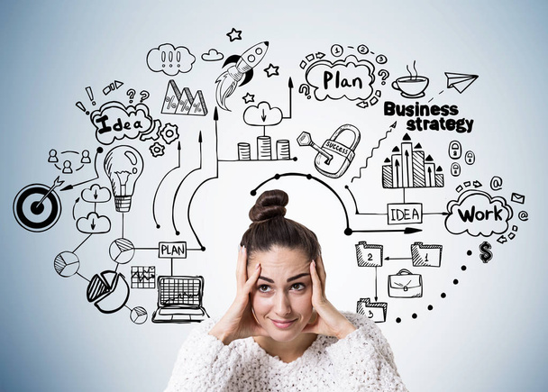 Stressed young woman with a bun, business plan - Photo, image