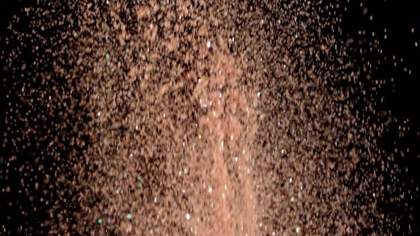 Realistische Glitter exploderen op zwarte achtergrond. - Foto, afbeelding