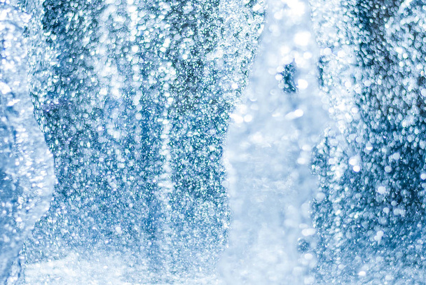 The gush of water of a fountain. Splash of water in the fountain, abstract image - Photo, Image