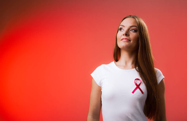 Woman wih pink cancer ribbon on chest - Foto, Imagem